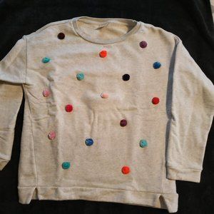 Sweater with color pompoms